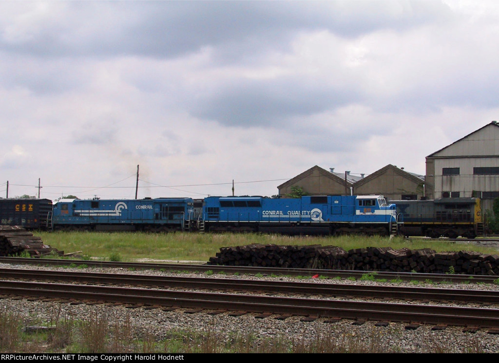 CSX 811 & 7116 lead an inbound train past the Emerson Shops